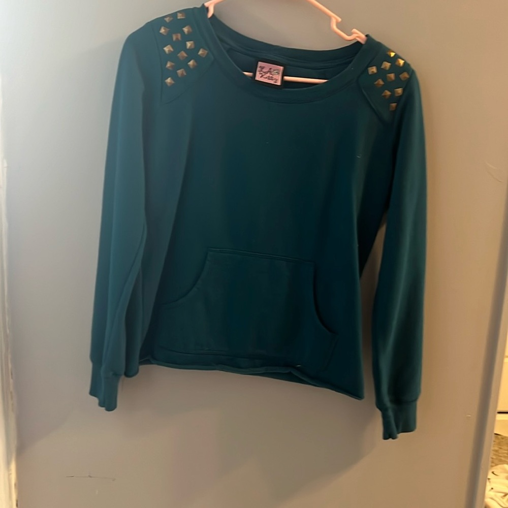 Fits like a girls size 10/12. Girls small. Sweatshirt material